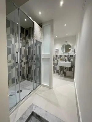 a bathroom with a shower and a sink at Hostel Centro Città Basement in Palermo