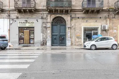 a white car parked in front of a building at GuestHost - Palermo Modern and Central Apartment x6 in Palermo