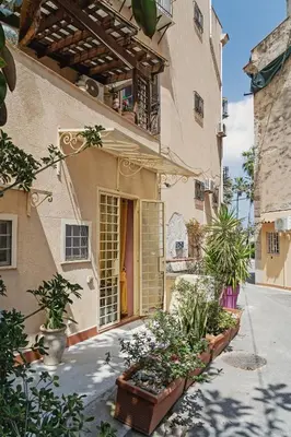 a house with some plants in front of it at CASA ARANCIO in Palermo