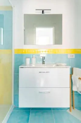 a bathroom with a sink and a mirror at Casa Mare me' in Mondello