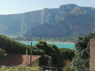 a view of a lake with mountains in the background at Casa Mare me' in Mondello