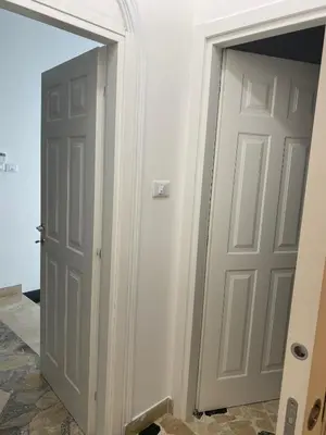 a hallway with two doors in a room at Holiday & House - Imparato Carini Costa Verde - Appartamento con giardino privato - porzione di Villa residenziale a pochi passi dal mare in Carini