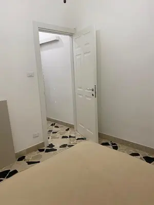 an empty room with a door and a tile floor at Holiday & House - Imparato Carini Costa Verde - Appartamento con giardino privato - porzione di Villa residenziale a pochi passi dal mare in Carini