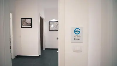 a hallway with a room with a sign on the wall at Mi Tierra Luxury Apartments in Palermo