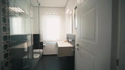 a bathroom with a sink and a toilet and a window at Mi Tierra Luxury Apartments in Palermo