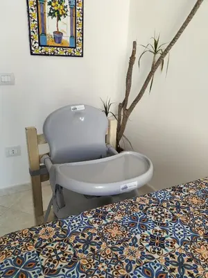 a bed with a chair and a bath tub in a room at InCentro Palermo in Palermo