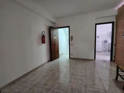 an empty room with a door and a tiled floor at DernaFlat 15 Climatizzata in Castellammare del Golfo