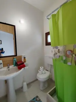 a bathroom with a sink and a toilet and a mirror at Casa Derna 25dx Climatizzata in Castellammare del Golfo