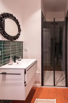 a bathroom with a white sink and a shower at Doma in Palermo