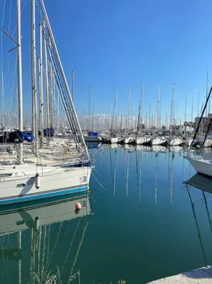 a bunch of boats docked in a harbor at CasaCecè kalsa in Palermo