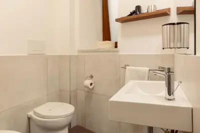 a small room with a bed and a table at Palermo Inn Studios in Palermo