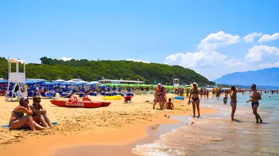 a group of people sitting on a beach at Casa Ventitré in Balestrate