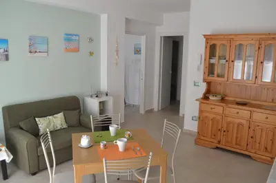 a living room with a couch and a table at Casa Ventitré in Balestrate