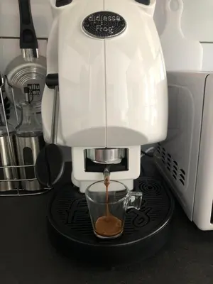 a coffee maker is making a cup of coffee at Siandri House in Palermo