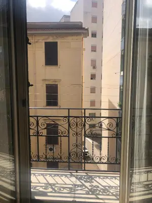 a balcony with a view of a building at Siandri House in Palermo