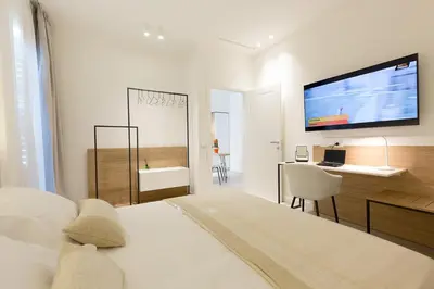 a living room with a couch and a table and chairs at Giada Luxury in Terrasini