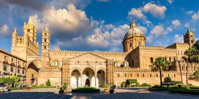 a large building with two towers on top of it at Dagnino House - Luxury apartment in the center of Palermo in Palermo