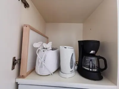 two coffeemakers and a coffee maker on a shelf at Dagnino House - Luxury apartment in the center of Palermo in Palermo