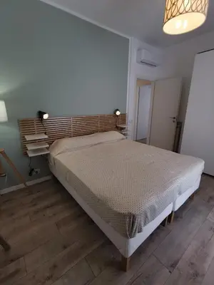 a bedroom with a large bed in a room at Dagnino House - Luxury apartment in the center of Palermo in Palermo