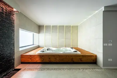 a bath tub in a room with a window at Villa vista mare Piscina e SPA in Castellammare del Golfo