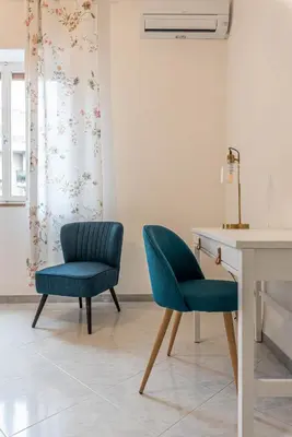 two chairs and a desk in a room at Casa Lincoln by Wonderful Italy in Palermo