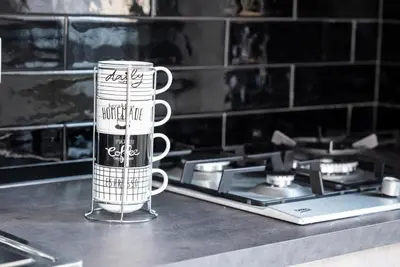 a coffee mug sitting on top of a kitchen counter at AVA VACATION HOME in Borgetto