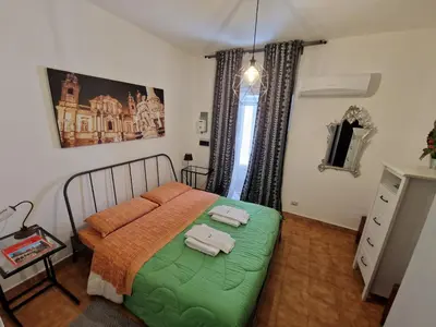 a living room with a couch and a television at N21 in Palermo