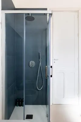 a shower with a glass door in a bathroom at Tenuta dei Principi di Spadafora in Bosco Fraccia
