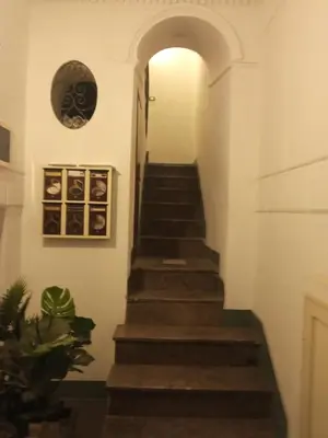 a stairway leading up to a hallway in a house at ZU' NICOLA in Palermo