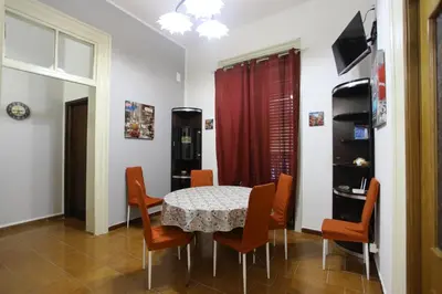 a dining room with a table and chairs at ZU' NICOLA in Palermo