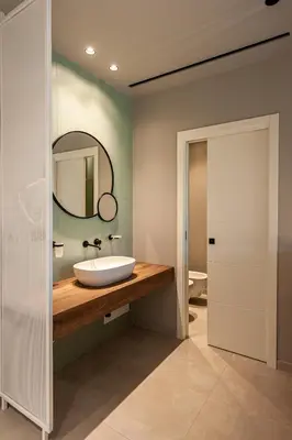 a bathroom with a sink and a mirror at Limen Wellness Hotel & Spa in Campofelice di Roccella