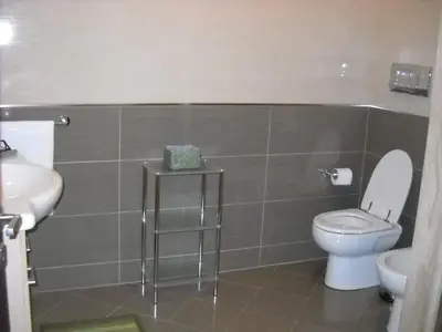 a bathroom with a toilet and a sink at Marconi e Garibaldi 76 apartment in Castellammare del Golfo