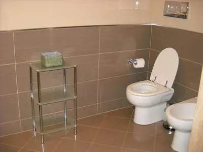 a bathroom with a toilet and a sink at Marconi e Garibaldi 76 apartment in Castellammare del Golfo