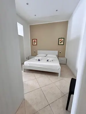 a bedroom with a white bed in a room at Leam Apartment 5 in Palermo