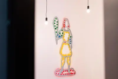 a wall hanging with a knife and spatula at Cortile dei Giusti - Combo Guesthouse in Palermo