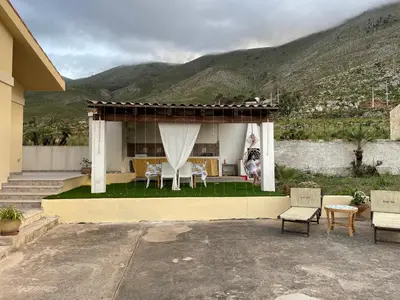 a gazebo with a table and chairs in a house at Villa Contrada Sauci in San Vito lo Capo