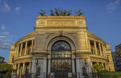 a large building with a fence in front of it at Quintino 57 Al Politeama - Tourist Lease in Palermo