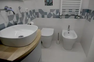 a bathroom with a sink and a toilet at Opera Suites - Norma in Palermo