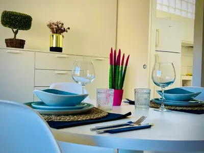 a table with plates and wine glasses on it at 38 HOUSE in Palermo
