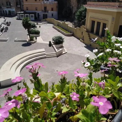 a view of a courtyard with pink flowers at Il Principe casa vacanze in Trabia