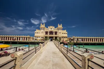 a building on a pier next to the water at casa di Enrico in Palermo