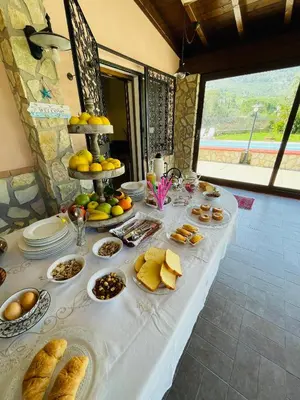 a table with bread and other food on it at Villa Inserra Deluxe in Palermo