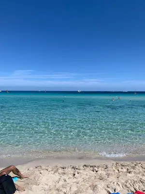 a person laying on the sand at the beach at Daziarosetta in Palermo