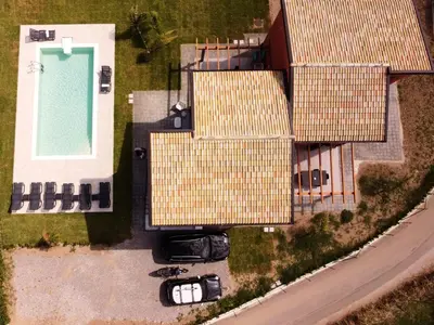 an aerial view of a house with a swimming pool at Salinelle Rooms in Lascari