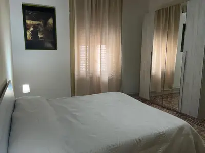 a bedroom with a white bed and a window at SPYDA in Palermo