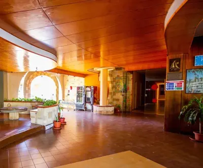 a large lobby with a large wooden ceiling at M'Place - Mondello Residence in Palermo