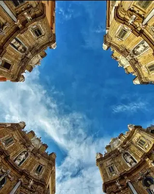 two tall buildings looking up at the sky at Perla Diva Apartment in Palermo