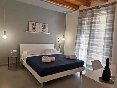 a bedroom with a bed with two towels on it at CasAnna in Castellammare del Golfo