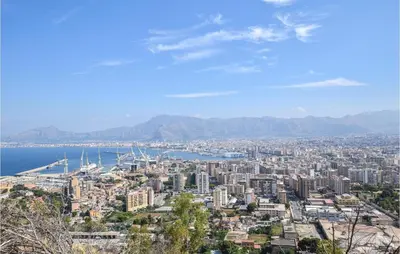 a view of a city with the ocean and mountains at Bilo 4 in Lido di Mondello