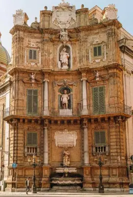 a building with a fountain in front of it at Virginia House 3 in Palermo